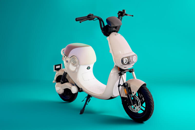 grey scooter with aqua background